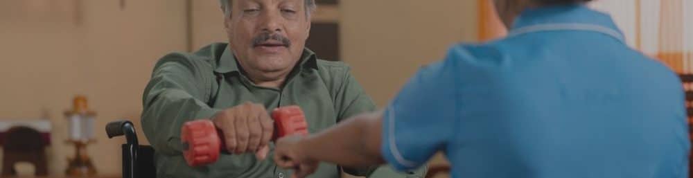 A Nurse Helping Patient Do Physical Exercise