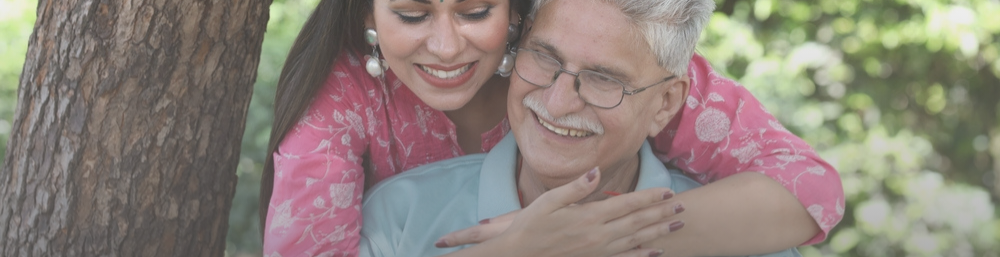 A Daughter Hugging her father from behind