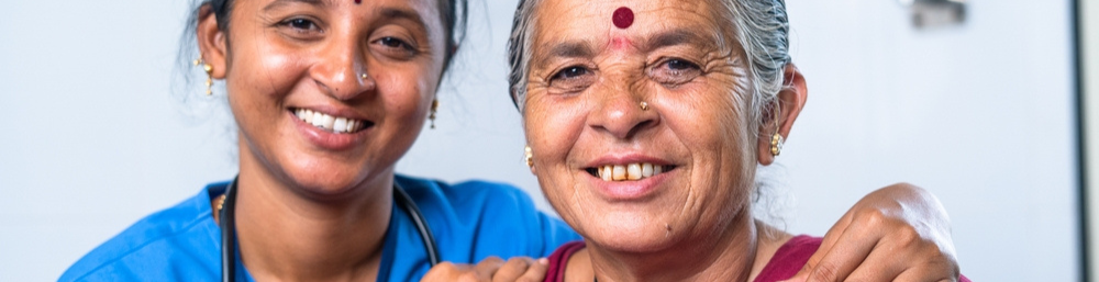 Caretaker And Elderly Smiling